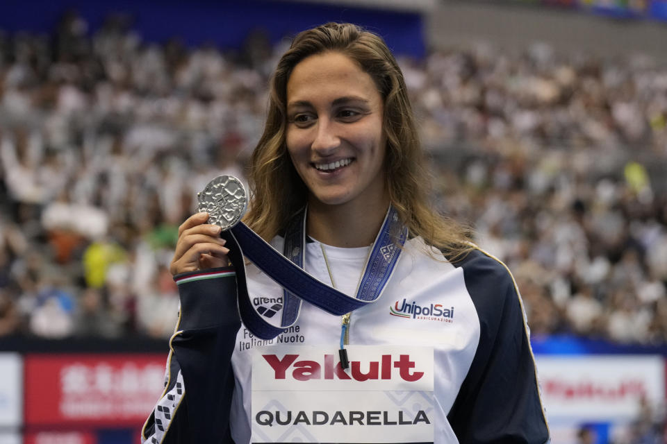 Silver medalist Simona Quadarella of Italy pose during ceremonies at women's 1500m freestyle finals at the World Swimming Championships in Fukuoka, Japan, Tuesday, July 25, 2023. (AP Photo/Lee Jin-man)