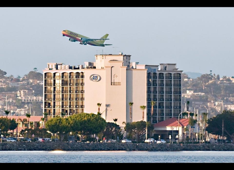 San Diego's airport (also called Lindbergh Field) is considered by some to be one of the country's most dangerous due to its downtown location. What's more, mountains to its north and east, Mexican airspace to its south, and tailwinds blowing in from its west sometimes force nose-to-nose takeoffs and landings.