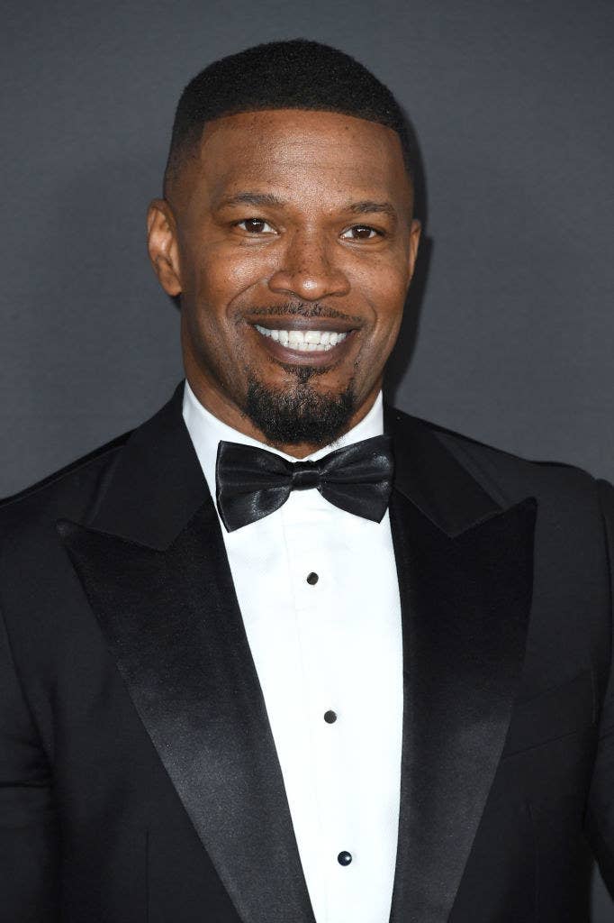 Jamie Foxx smiling. He&#39;s wearing a suit and bowtie