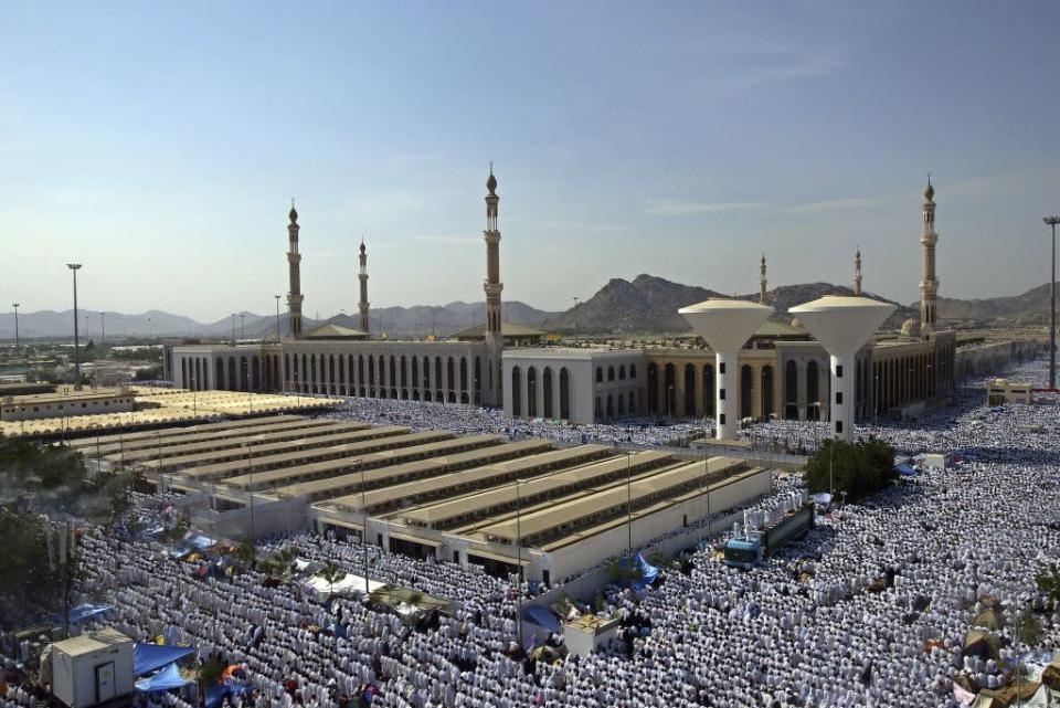 <b>ARAFAT, SAUDI ARABIA: </b>Muslim pilgrims attend noon prayers at the Nimira mosque in Arafat, outside the holy city of Mecca in Saudi Arabia. Muslim pilgrims journey to Arafat, a revered place in Islam, for the culmination of the Hajj rituals. Mount Arafat, about 70 metres high, is a granite hill to the east of the Holy City of Makkah. The pious believe that it was on Mount Arafat that Adam and Eve, separated for 200 years, recognized each other and were reunited.