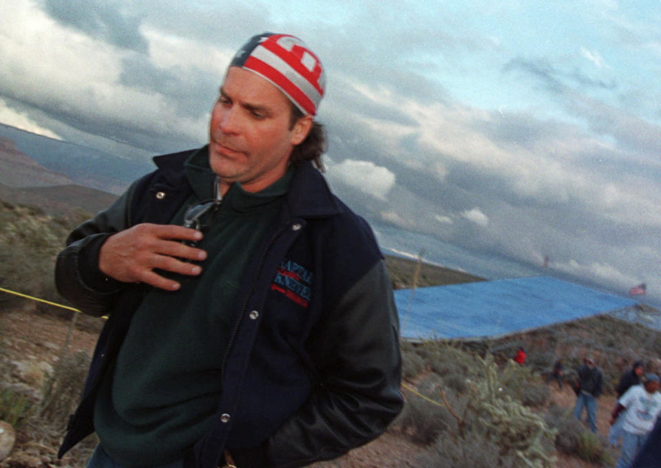 File - In this April 29, 1999, file photo, Robbie Knievel leaves his jump sight on the Hualapai Reservation in Ariz., after deciding not to make the Grand Canyon Death Jump due to high winds and cold weather. When actor Will Smith turns 50 on Tuesday, Sept. 25, 2018, he will jump head-first into the big milestone. The “Fresh Prince” plans to bungee jump from a helicopter over a gorge just outside Grand Canyon National Park. His birthday activity is the latest in a vast history of outrageous stunts staged in and around one of the world’s seven natural wonders. (AP Photo/Laura Rauch, File)