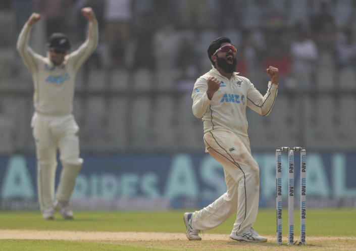 New Zealand's Ajaz Patel celebrates the dismissal of India's Mohammed Siraj during the day two of their second test cricket match with India in Mumbai, India, Saturday, Dec. 4, 2021.(AP Photo/Rafiq Maqbool)