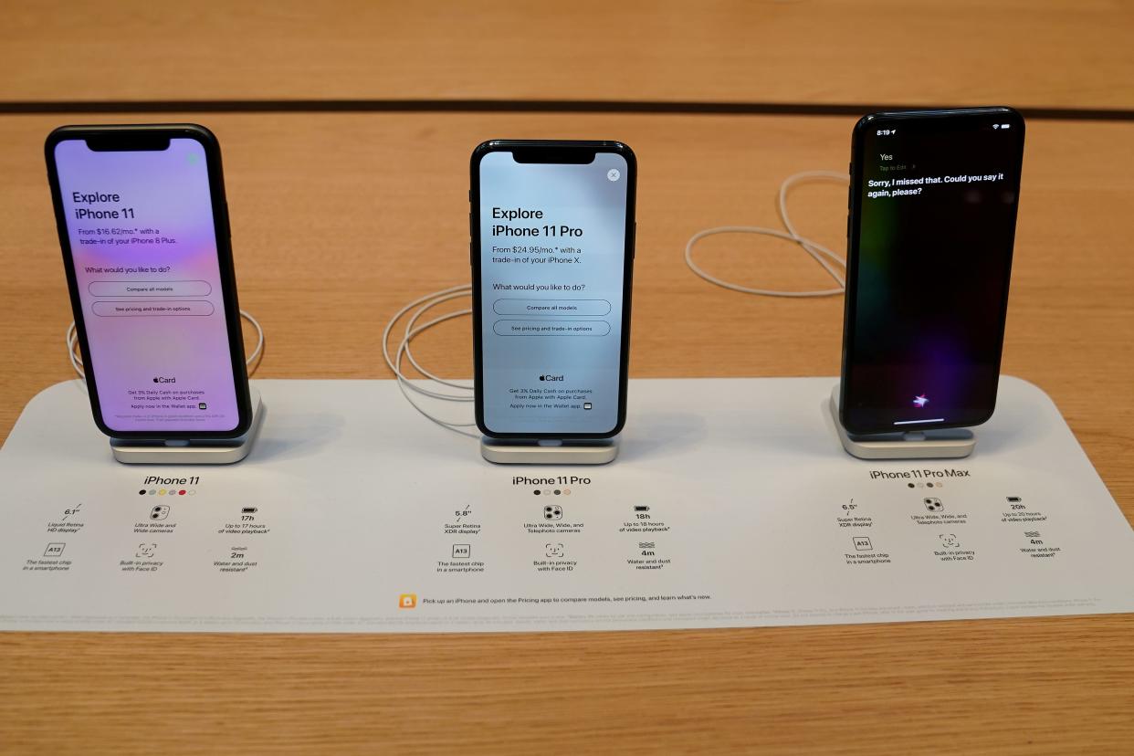 FILE PHOTO: Apple iPhone 11's are pictured inside of the Apple Store on Fifth Ave in the Manhattan borough of New York, New York, U.S., September 20, 2019. REUTERS/Carlo Allegri