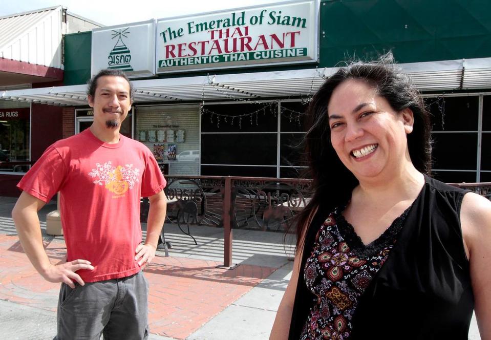 Dara Quinn, and her brother, Billy, co-owners of Emerald of Siam, stand outside their Richland restaurant and music venue in the Uptown Shopping Center in Richland.