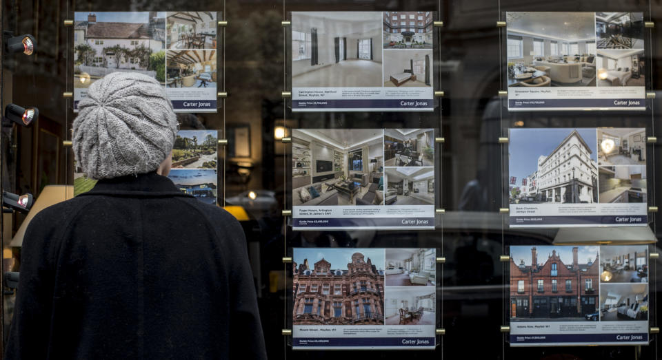 File photo dated 22/3/2017 of a woman looking in the window of an estate agents. Liverpool, Aberdeen, Cardiff and Nottingham are among the best locations for single house hunters to buy a property, analysis suggests.