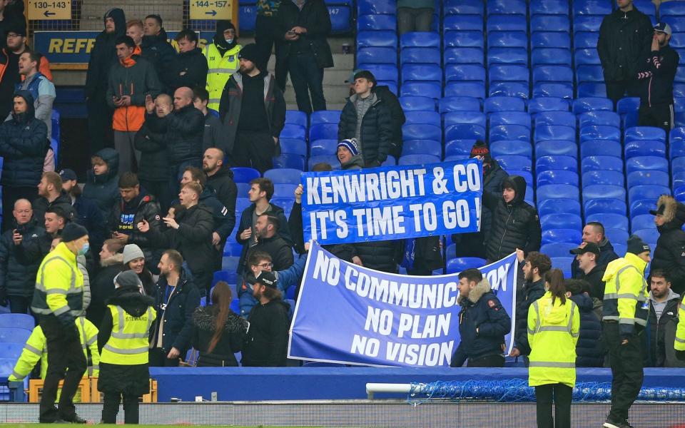 Everton fans wave a banner following the English Premier League football match between Everton and Aston Villa at Goodison Park in Liverpool, north west England on January 22, 2022 - AFP