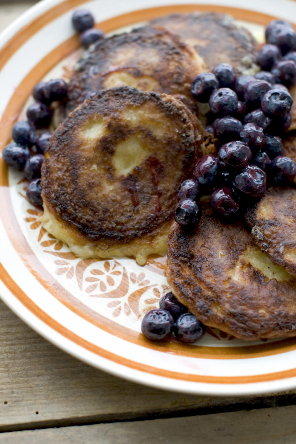 This Jan. 6, 2014 photo shows lemon syrniki in Concord, N.H. Syrniki is a farm-style cheese pancake, sort of a cross between cheesecake and pancakes. It can be served for breakfast, tea, a light meal or a snack. (AP Photo/Matthew Mead)