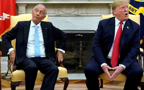 U.S. President Trump speaks to reporters during meeting with Portugal's President Rebelo de Sousa at the White House in Washington - Credit: Reuters