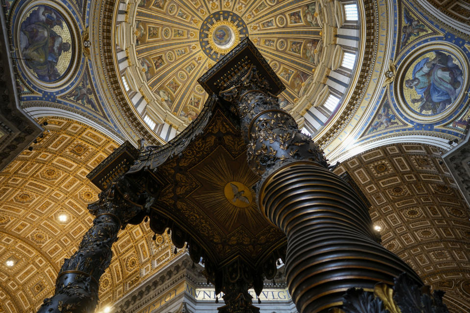 A view of the 17th century, 95ft-tall bronze canopy by Giovan Lorenzo Bernini surmounting the papal Altar of the Confession in St. Peter's Basilica at the Vatican, Wednesday, Jan. 10, 2024. Vatican officials unveiled plans Thursday, Jan.11, for a year-long, 700,000 euro restoration of the monumental baldacchino, or canopy, of St. Peter's Basilica, pledging to complete the first comprehensive work on Bernini's masterpiece in 250 years before Pope Francis' big 2025 Jubilee. (AP Photo/Andrew Medichini)