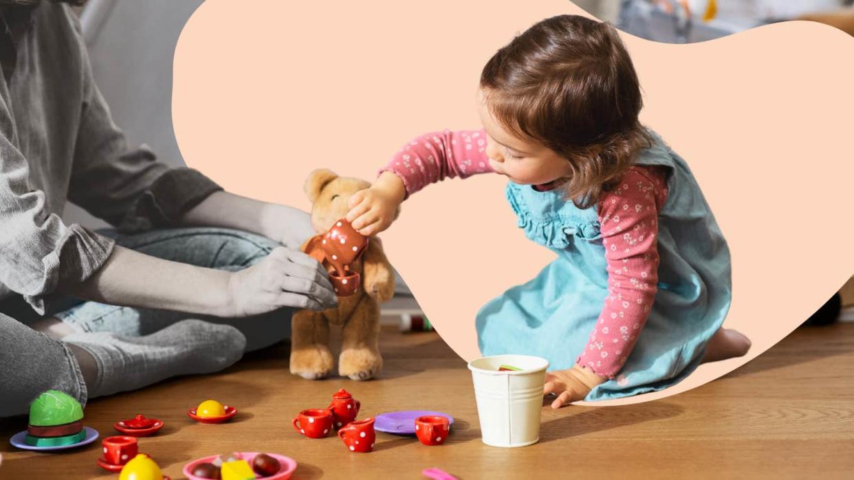 mom engaging in pretend play with daughter