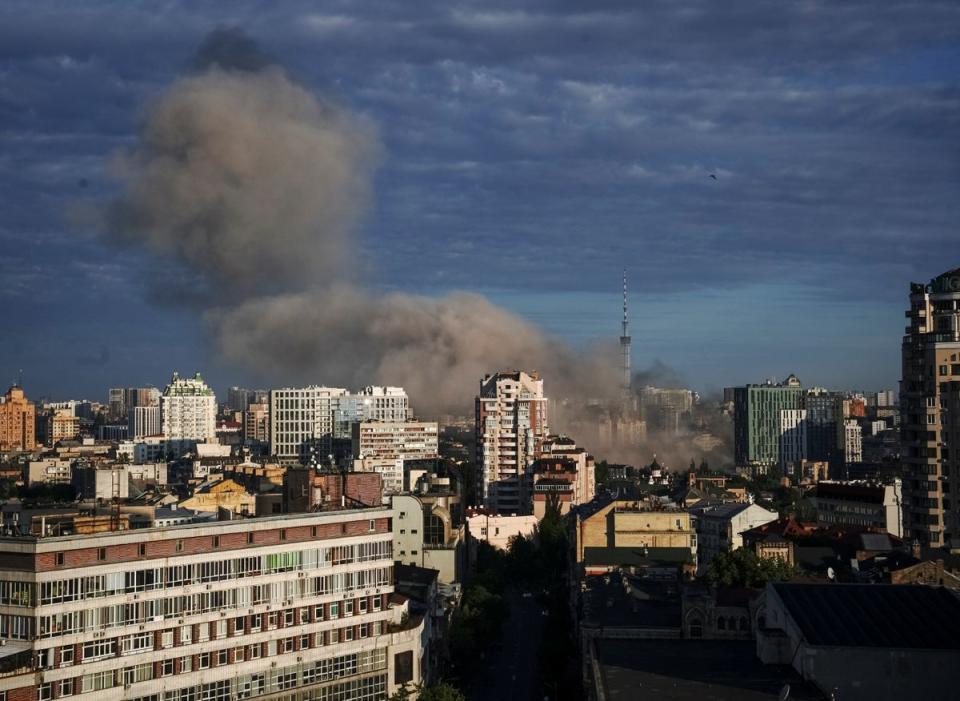 Smoke rises after a missile strike in Kyiv on Sunday morning (Reuters)