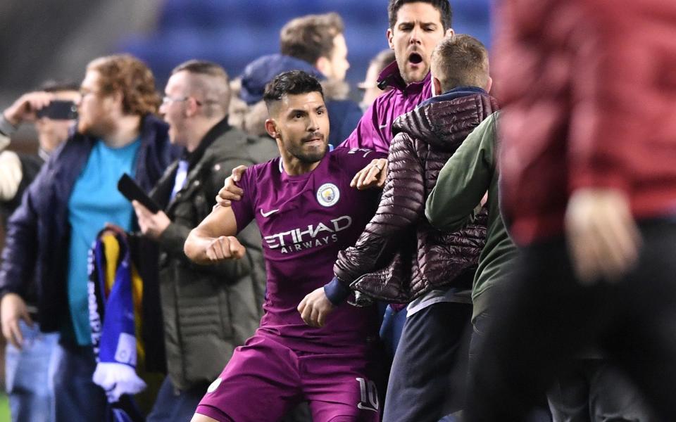 Sergio Aguero appeared to react following a confrontation with a pitch invader on Monday night - Getty Images Europe