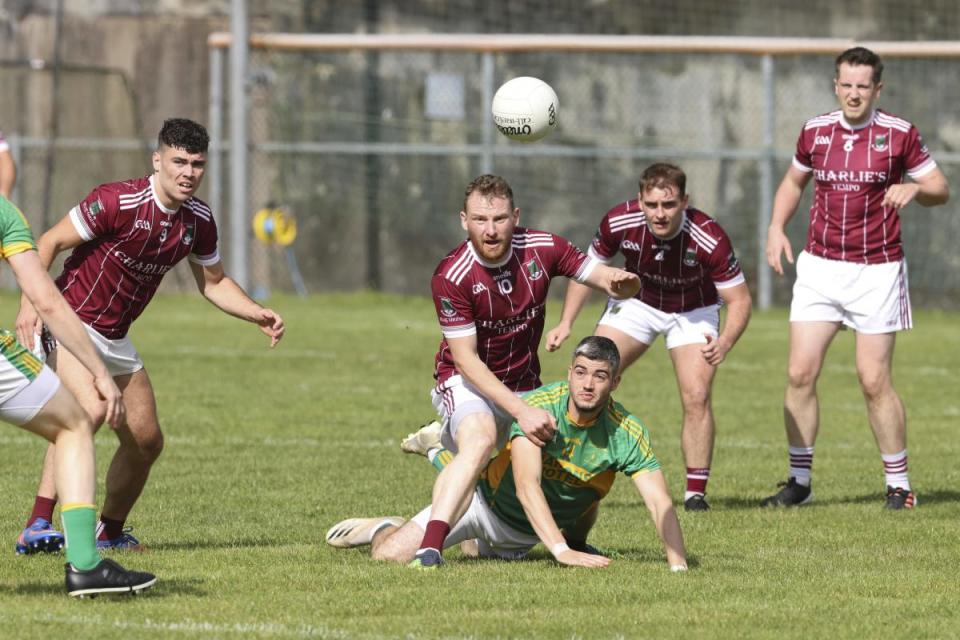 Tempo's Aidan Breen (centre) hit his side's third goal.