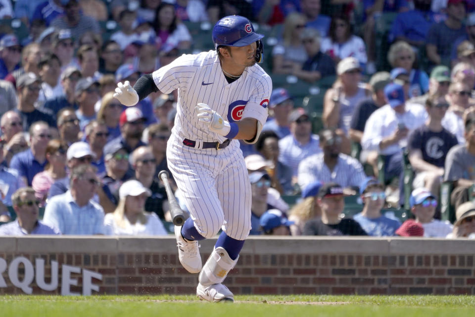Chicago Cubs' Seiya Suzuki watches his RBI single off St. Louis Cardinals starting pitcher Adam Wainwright during the third inning of a baseball game Tuesday, Aug. 23, 2022, in Chicago. (AP Photo/Charles Rex Arbogast)