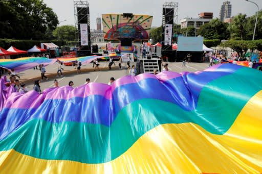 LGBT rights supporters prepare for the Gay Pride parade in Taipei which is the biggest in Asia