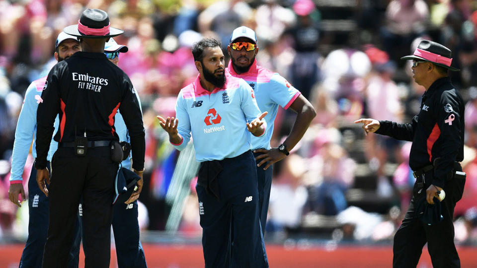 Adil Rashid (pictured middle) speaks to the umpires as Rassie van der Dussen is given not out on review during the 3rd One Day International match between England and South Africa on February 09, 2020 in Johannesburg, South Africa. (Photo by Dan Mullan/Getty Images)