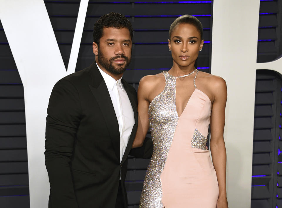 FILE - Russell Wilson, left, and Ciara arrive at the Vanity Fair Oscar Party in Beverly Hills, Calif. on Feb. 24, 2019. Wilson and his pop star wife Ciara are now parents to a baby boy. The couple announced Friday the birth of their son named Win Harrison Wilson on Instagram. (Photo by Evan Agostini/Invision/AP, File)
