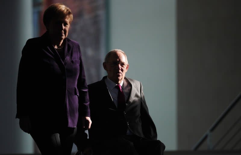 Wolfgang Schauble (L), then German Minister of Finance, and Angela Merkel, then German Chancellor, attend a press conference at the Federal Chancellery. Merkel says she learnt of the death of her former finance minister Wolfgang Schäuble "with great dismay" and has characterized him as one of the country's most important political figures. Hannibal Hanschke/dpa