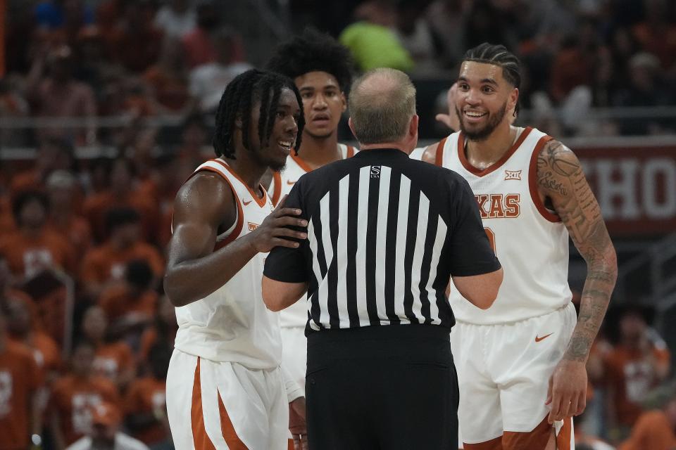 Texas players Marcus Carr and Timmy Allen plead their case to the official during Monday night's 72-57 win over UTEP. It was the first game of the season for the Longhorns and also the first regular-season basketball game in Moody Center history.