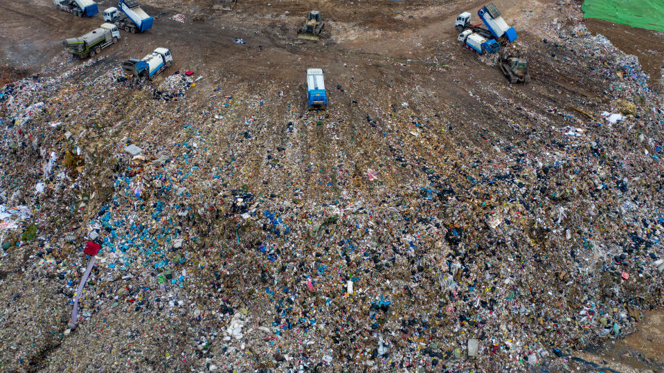 Chinese workers sort out and bury kitchen waste at the Jiangcungou Landfill, which is the China's largest refuse landfill, in Xi'an city, northwest China's Shaanxi province, 21 August 2019. China's largest refuse landfill was set to close in October 2019 as it was almost saturated in Xi'an city, northeast China's Shaanxi province. The landfill was put into use in June 1994. (Photo by Tian ye - Imaginechina/Sipa USA)