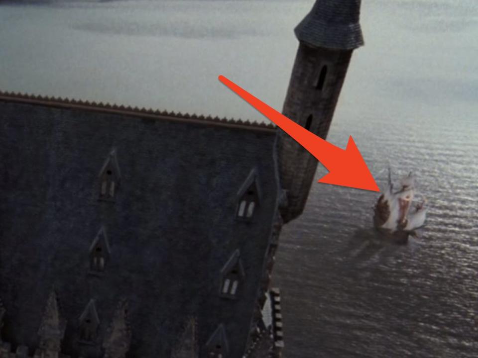 arrow pointing to the durmstrong boat in the great lake outside of hogwarts castle in goblet of fire