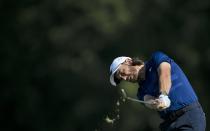 England's Tommy Fleetwood plays a shot on the first hole during the final round of the Abu Dhabi Championship golf tournament in Abu Dhabi, United Arab Emirates, Sunday, Jan. 19, 2020. (AP Photo/Kamran Jebreili)