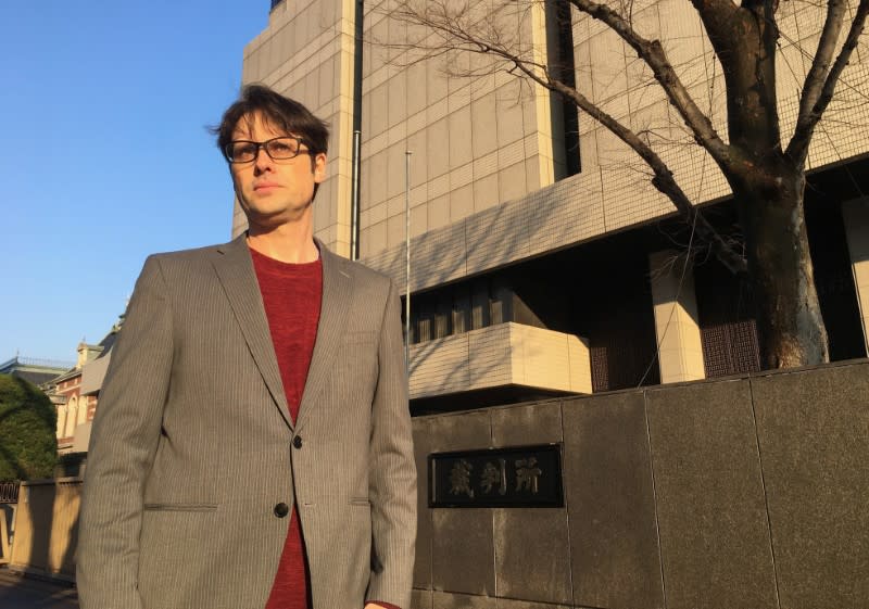 Scott McIntyre, an Australian sports journalist, poses for a photograph before his sentencing outside Tokyo District Court in Tokyo
