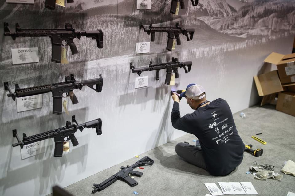 <div class="inline-image__caption"><p>A worker helps prepare a Daniel Defense booth at the NRA convention in Indianapolis in 2019.</p></div> <div class="inline-image__credit">Jeremy Hogan/SOPA Images/LightRocket via Getty</div>