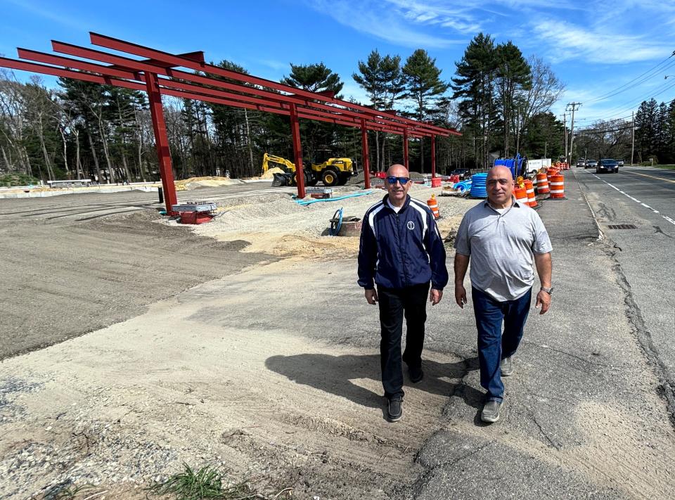 Daniel Lima, left, and Bruce Thomas are seen here April 29 at the Bay Street site of what will be their Mobil gas station and convenience store featuring New York Bagel Company.