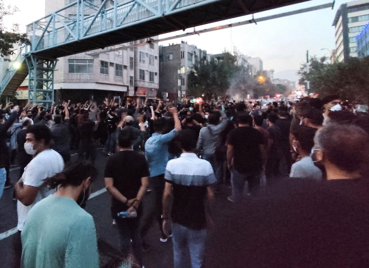 In this Sept. 21, 2022, photo, Iranian demonstrators gather along a street in Tehran. <a href="https://www.gettyimages.com/detail/news-photo/picture-obtained-by-afp-outside-iran-on-september-21-shows-news-photo/1243408188?adppopup=true" rel="nofollow noopener" target="_blank" data-ylk="slk:AFP via Getty Images;elm:context_link;itc:0;sec:content-canvas" class="link ">AFP via Getty Images</a>