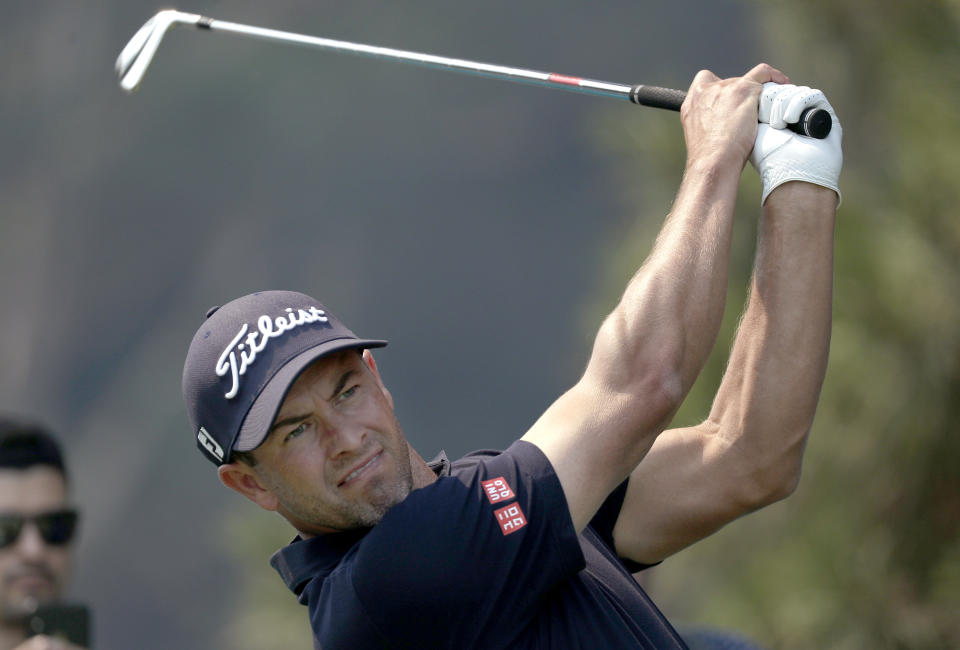 Australia's Adam Scott tees off on the 13th during the Australian Open Golf Pro-AM in Sydney, Wednesday, Dec. 4, 2019. The Australian Open begins Thursday. (AP Photo/Rick Rycroft)