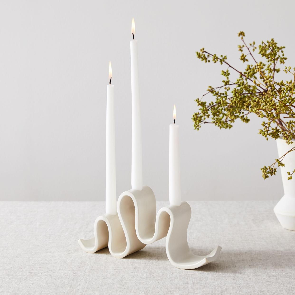 <p><a href="https://go.redirectingat.com?id=74968X1596630&url=https%3A%2F%2Fwww.westelm.com%2Fproducts%2Fsin-wyat-candelabra-d13877&sref=https%3A%2F%2F" rel="nofollow noopener" target="_blank" data-ylk="slk:Shop Now;elm:context_link;itc:0;sec:content-canvas" class="link rapid-noclick-resp">Shop Now</a></p><p>SIN Wyat Candelabra</p><p>westelm.com</p><p>$90.00</p>