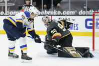 CORRECTS TO SHOOTOUT, INSTEAD OF OVERTIME - St. Louis Blues center Brayden Schenn (10) scores on Vegas Golden Knights goaltender Robin Lehner (90) in the shootout of an NHL hockey game Tuesday, Jan. 26, 2021, in Las Vegas. (AP Photo/John Locher)