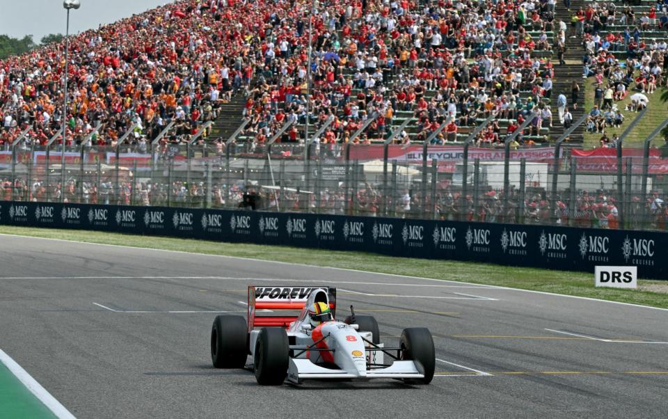 Sebastian Vettel drives Ayrton Senna's historic McLaren car