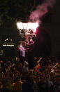 Barcelona fans celebrate in the street after their team won the Spanish La Liga championship by beating crosstown rivals Espanyol in Barcelona, Spain, Sunday May 14, 2023. (AP Photo/Joan Mateu Parra)