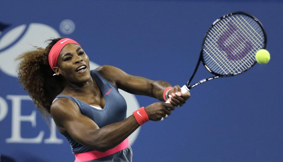 Serena Williams, of the United States, returns against Francesca Schiavone, of Italy, during the first round of the 2013 U.S. Open tennis tournament, Monday, Aug. 26, 2013, in New York. (AP Photo/Charles Krupa)