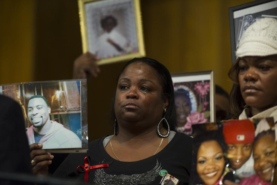 Antionette Johnson, of Oakland, California, holds a photo of her son Terrell Reams, 23, who was shot and killed in Oakland, at a 2013 meeting of groups working to prevent gun violence. (Photo: Rod Lamkey via Getty Images)