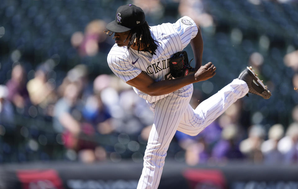 Colorado Rockies starting pitcher Jose Urena works against the Texas Rangers in the first inning of a baseball game Wednesday, Aug. 24, 2022, in Denver. (AP Photo/David Zalubowski)