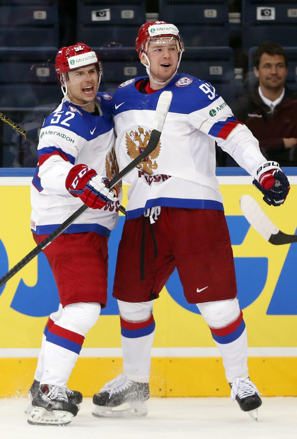 Russia's Sergei Shirokov, left and Yevgeni Kuznetzov celebrate their goal during the Group B preliminary round match between Switzerland and Russia at the Ice Hockey World Championship in Minsk, Belarus, Friday, May 9, 2014. (AP Photo/Darko Bandic)