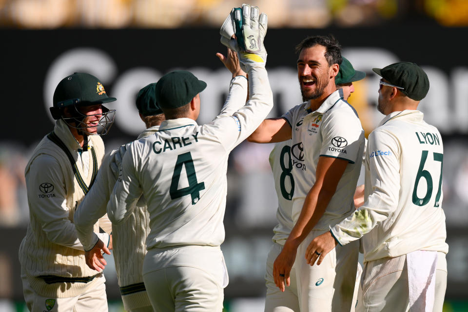 MELBOURNE, AUSTRALIA - DECEMBER 29: Mitchell Starc of Australia celebrates the wicket of Salman Ali Agha of Pakistan during day four of the Second Test Match between Australia and Pakistan at Melbourne Cricket Ground on December 29, 2023 in Melbourne, Australia. (Photo by Morgan Hancock - CA/Cricket Australia via Getty Images)