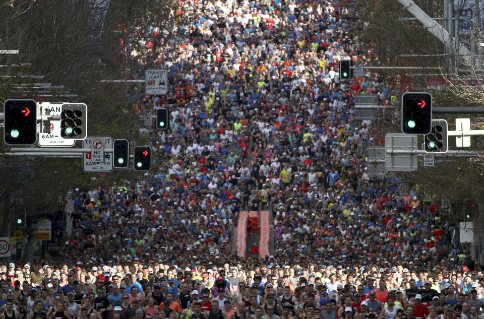 In this Sunday, Aug. 12, 2018, photo, some of the 80,000 participants in the annual City2surf fun run make their way along the 14km (8.7 miles) course in Sydney. (AP Photo/Rick Rycroft, File)