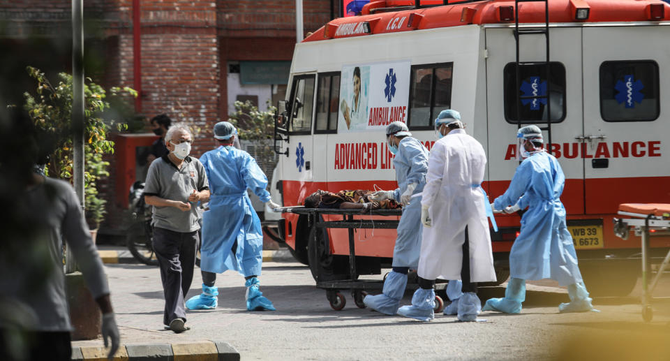 A man arrives on a stretcher at Lok Nayak Jai Prakash Hospital in Old Delhi.