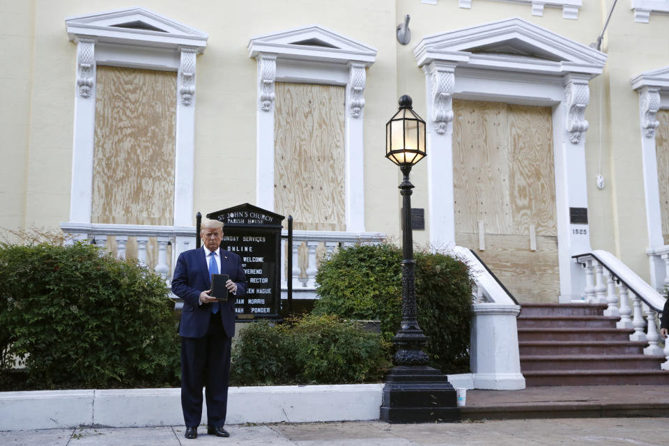 President Donald Trump holds a Bible as he visits outside St. John's Church across Lafayette Park from the White House Monday, June 1, 2020, in Washington. Part of the church was set on fire during protests on Sunday night. (AP Photo/Patrick Semansky)