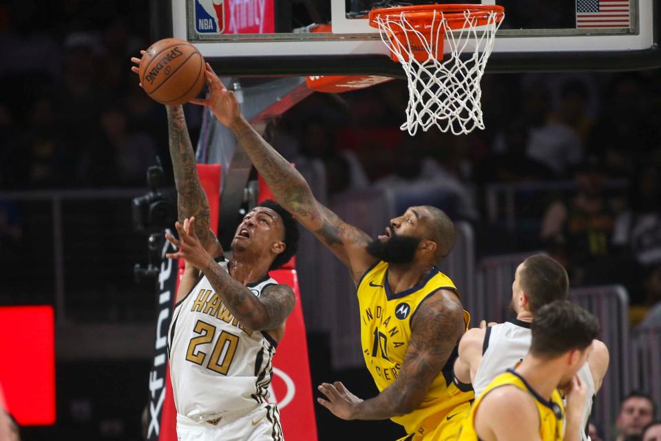 Apr 10, 2019; Atlanta, GA, USA; Atlanta Hawks forward John Collins (20) is blocked by Indiana Pacers center Kyle O'Quinn (10) in the second quarter at State Farm Arena.