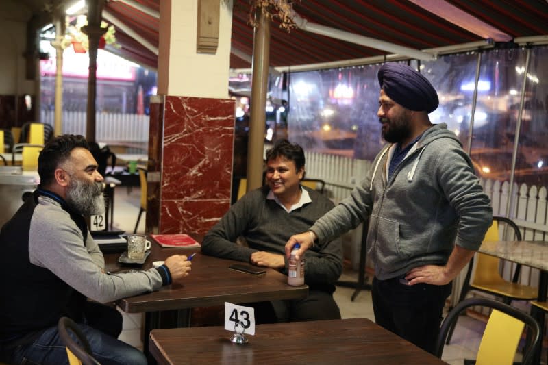 Small business owners visit an Indian restaurant, amidst the easing of the coronavirus disease (COVID-19) restrictions, in Sydney