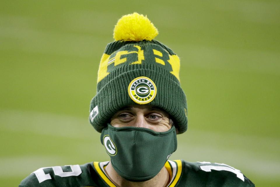 Green Bay Packers' Aaron Rodgers wears a mask after an NFL football game against the Philadelphia Eagles Sunday, Dec. 6, 2020, in Green Bay, Wis. The Packers won 30-16. (AP Photo/Mike Roemer)