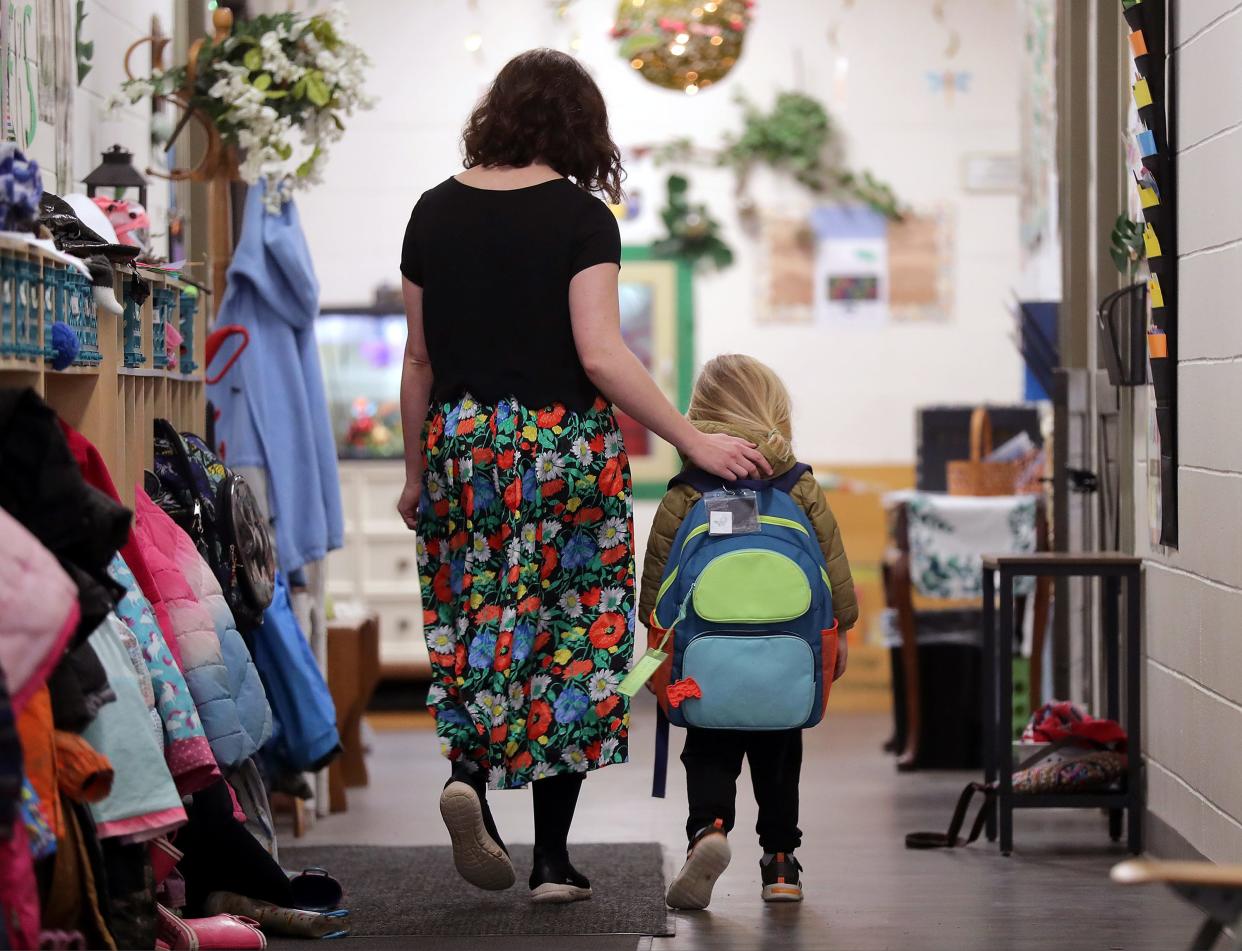 Program director Carissa Tiaklasky walks with a student at Lake Edge Learning Center in Neenah on April 11. Lake Edge Learning Center is one of many local child care programs that enlist the help of Child Care Resource and Referral Inc.'s early childhood support coordinator to navigate children's behavioral challenges. Tiakalsky said the CCR&R position helped reduce expulsions at the center.