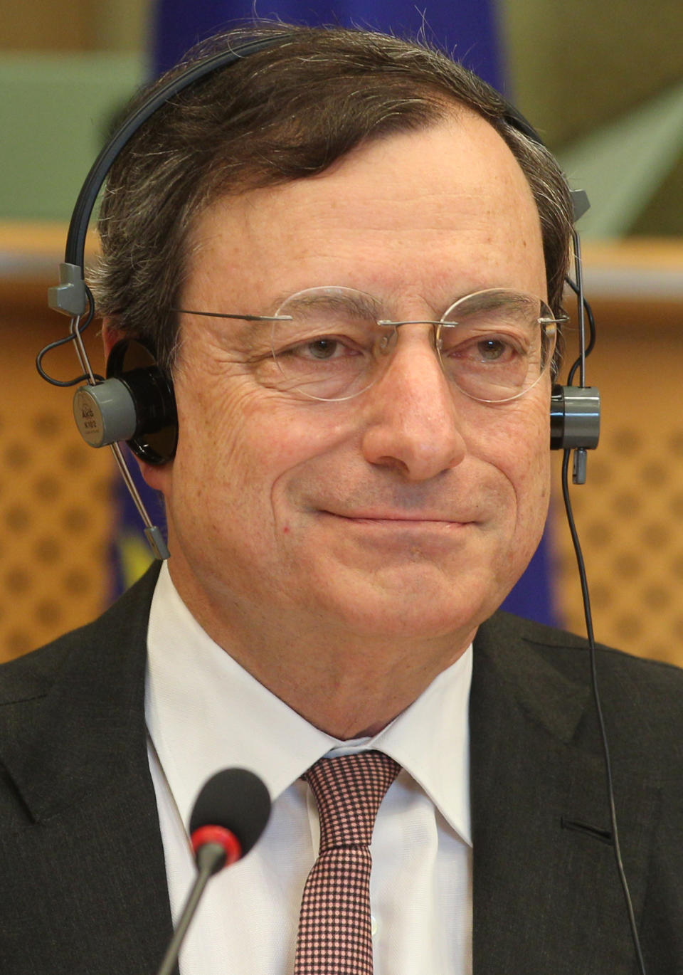 President of the European Central Bank Mario Draghi smiles as he reports to the Economic Committee, in capacity as the head of the European Systemic Risk Board, at the European Parliament in Brussels, Thursday, May 31, 2012. (AP Photo/Yves Logghe)
