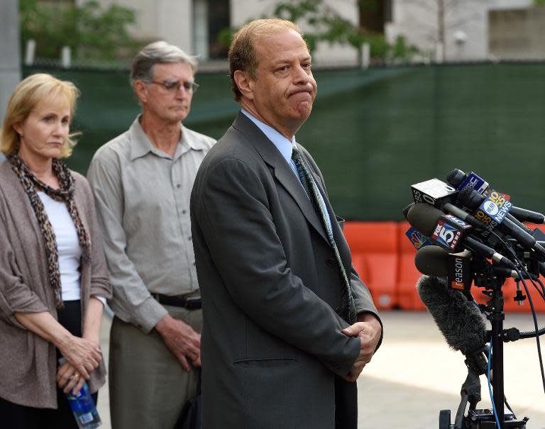 Ross Ulbricht's attorney Joshua Dratel (R) speaks to reporters as Lyn (L) and Kirk (C) Ulbricht, parents of Silk Road founder Ross Ulbricht, listen outside the Federal Courthouse on May 29, 2015 in New York