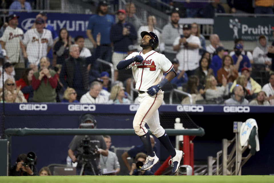 Atlanta Braves' Travis Demeritte reacts after hitting a solo home run during the fifth inning of a baseball against the Chicago Cubs at Truist Park Tuesday, April 26, 2022, in Atlanta. (Jason Getz/Atlanta Journal-Constitution via AP)